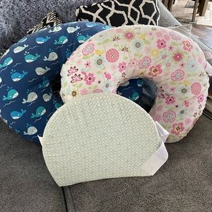 Two original Boppy pillows and one pregnancy wedge.